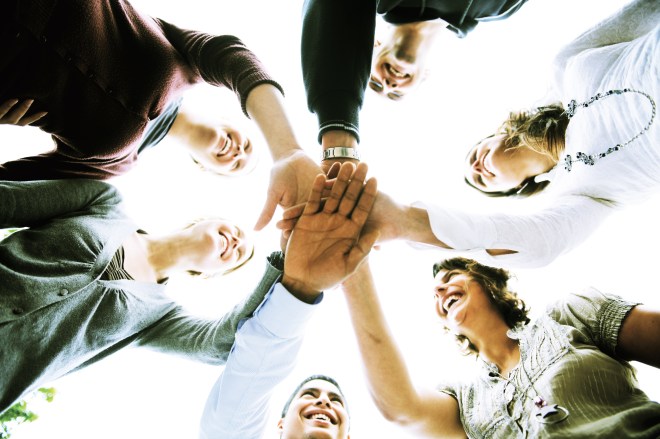 "A group of people with hands joined", by DG EMPL, Flicker